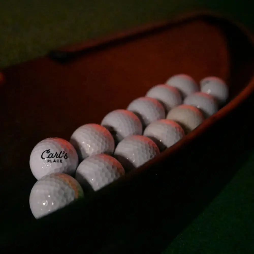 rubber golf ball tray collection of balls closeup