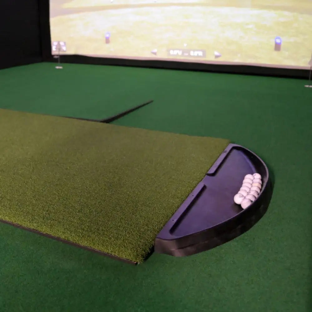 diy golf ball tray and hitting mat in front of impact screen