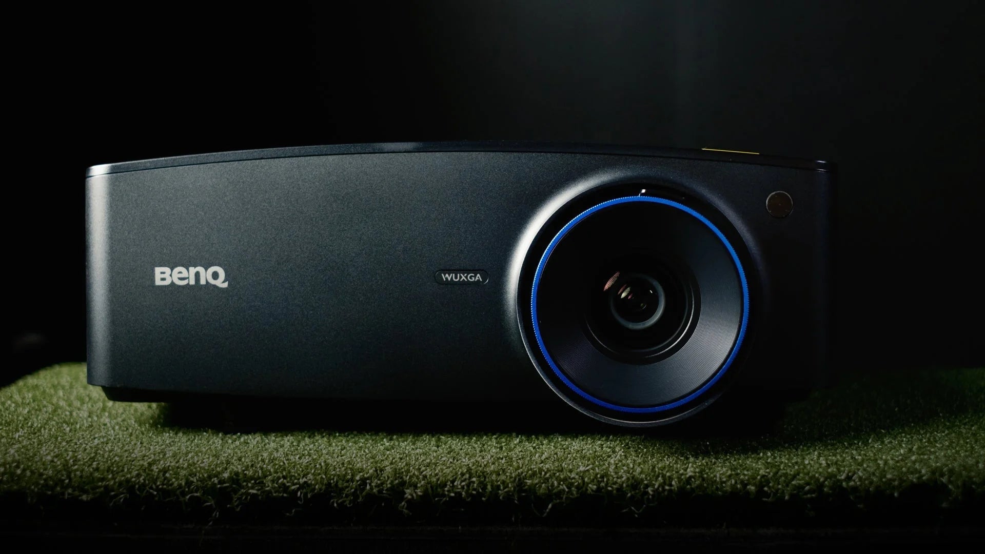 golf projector on grass black background