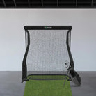 hitting golf net with clubs and hitting mat