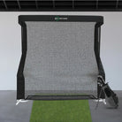 indoor golf net with clubs and mat front on view